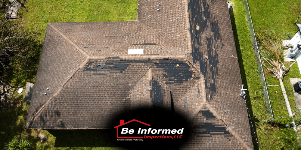 1 Aerial view of a Dallas–Fort Worth home roof with visible hail and wind damage on asphalt shingles