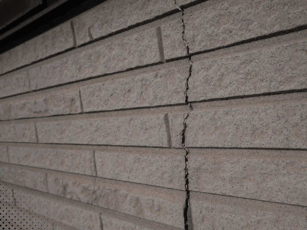 Vertical brick crack from possible foundation movement during a Dallas home inspection